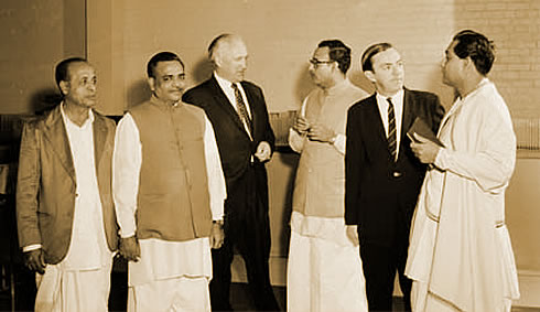 A group of men standing next to each other.