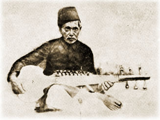 A man playing an instrument while sitting on the ground.
